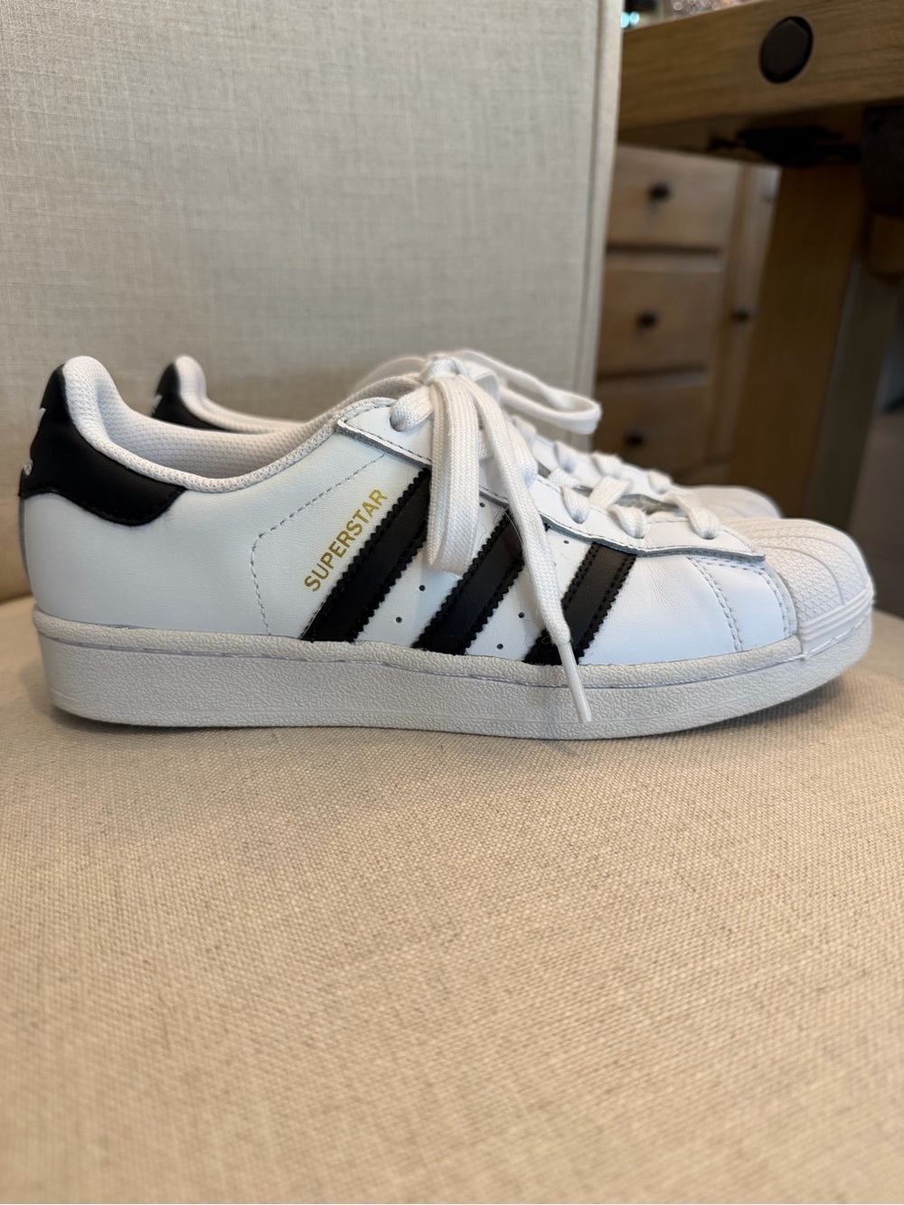 adidas women’s Superstar Sneakers in White and Black